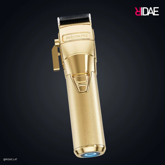 Cortadora BaBylissPRO GoldFX FX870G dorada profesional con mango metálico.